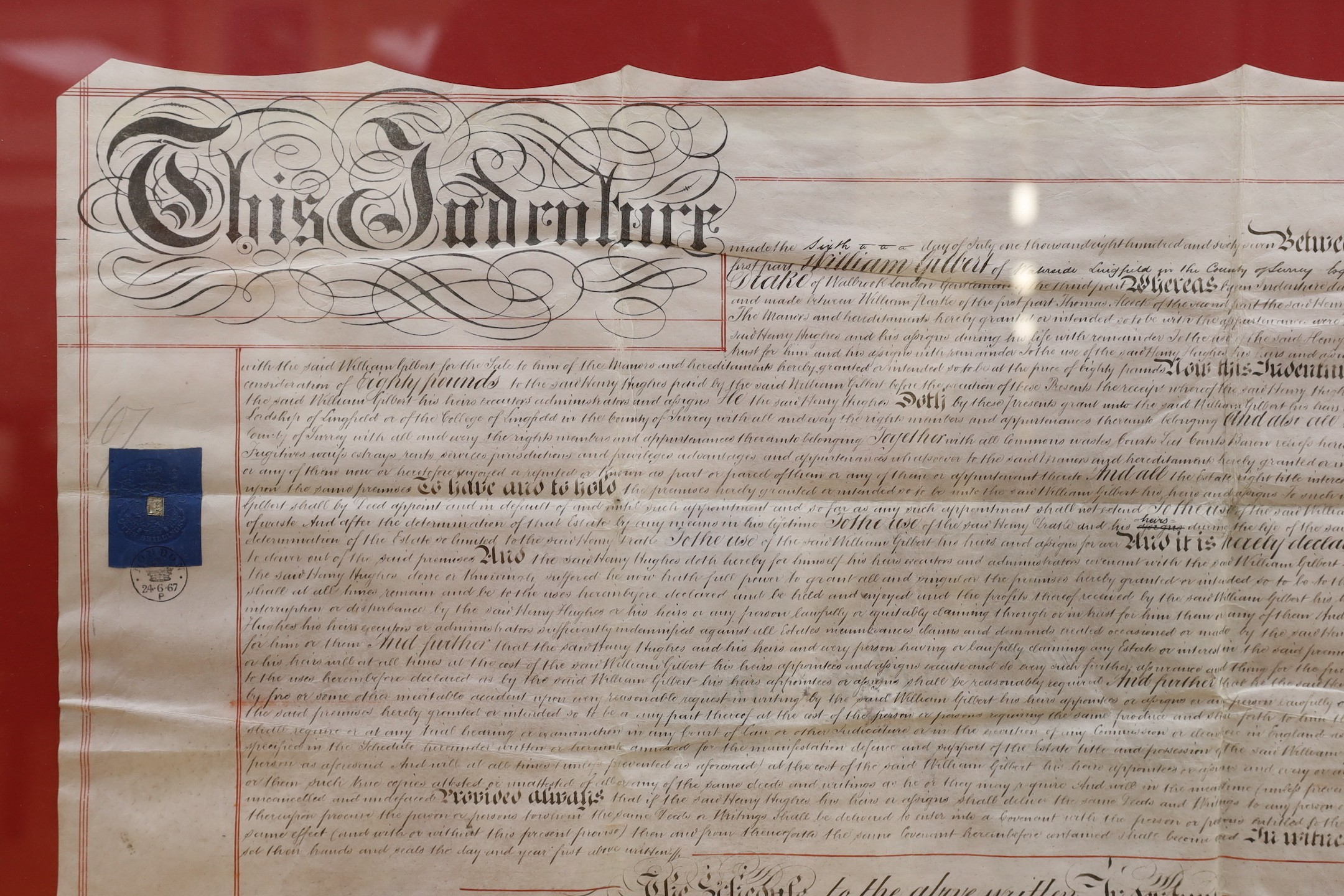A framed 19th century indenture, for Henry Gilbert of Lingfield, 71 cms wide x 57 cms high.